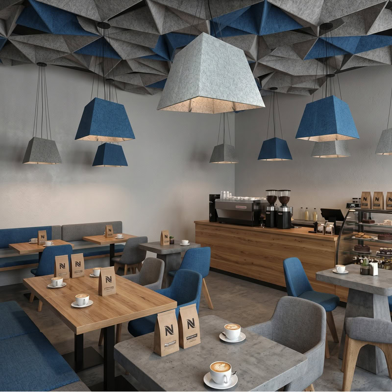 Acoustic pyramid pendant light in felt finish, suspended from black ceiling canopy.