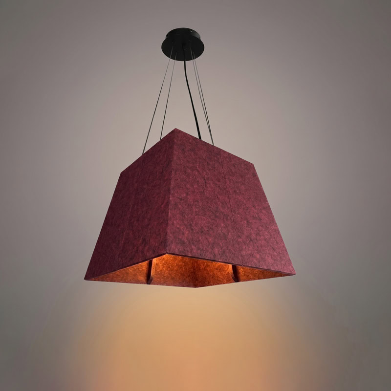 Acoustic pyramid pendant light in felt finish, suspended from black ceiling canopy.