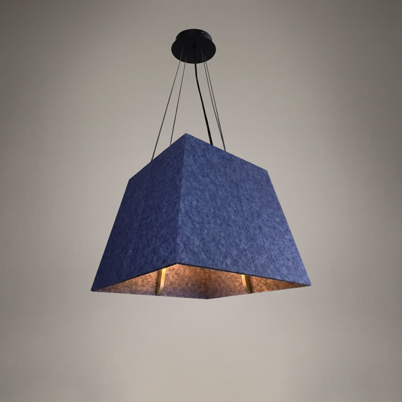 Acoustic pyramid pendant light in felt finish, suspended from black ceiling canopy.
