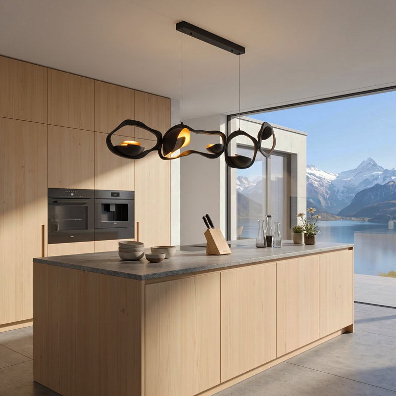 Black Designer Sculptural Pendant Light NOVARA LG363 with flowing curvilinear metal rings in a black and gold finish above an interior setting
