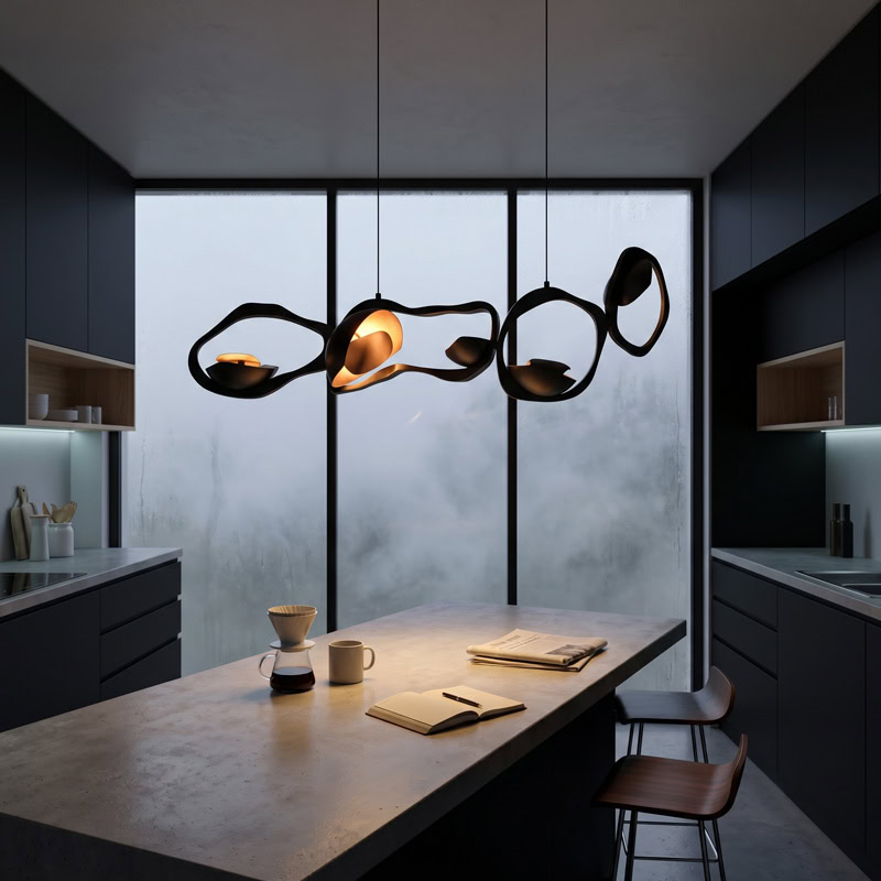 Black Designer Sculptural Pendant Light NOVARA LG363 with flowing curvilinear metal rings in a black and gold finish above an interior setting