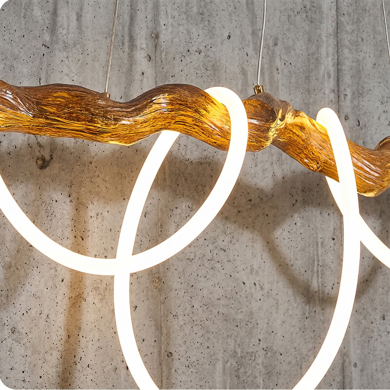 Sculptural resin rope pendant light with integrated LED, organic branch-inspired design, and 360° illumination for modern interiors.