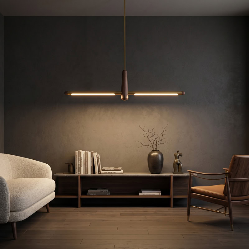 Walnut brass linear pendant light with integrated LED suspended over interior space